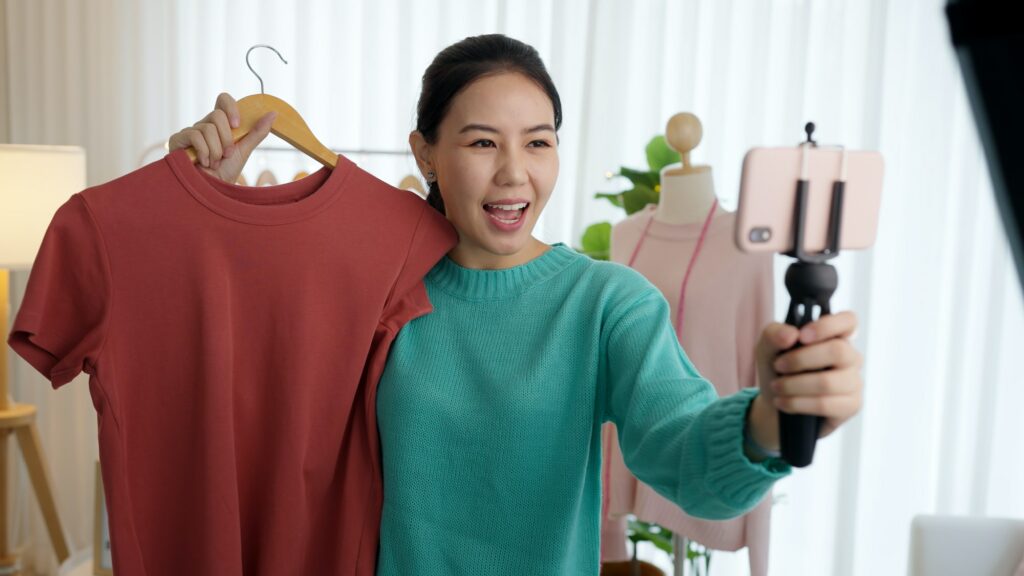 Asia vlogger woman influencer, SME retail store owner smile enjoy selling show live sale