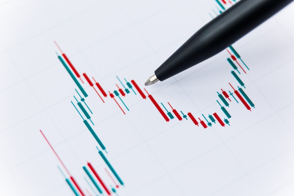 Women hand and graph chart with falling trend.